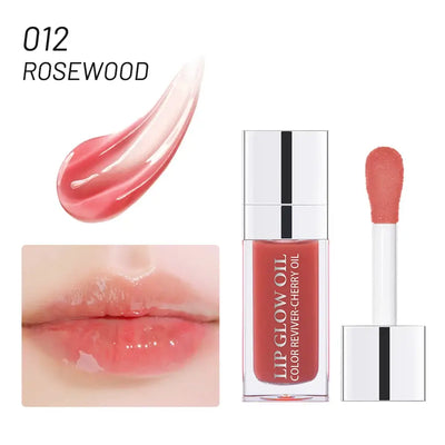 Frost Glow Cosmetics lip oil balms in pink, coral, and berry shades on a pink background.