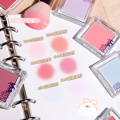Frost Glow Cosmetics brightening blush in pink tone with applicator and swatch, ideal for a youthful glow.