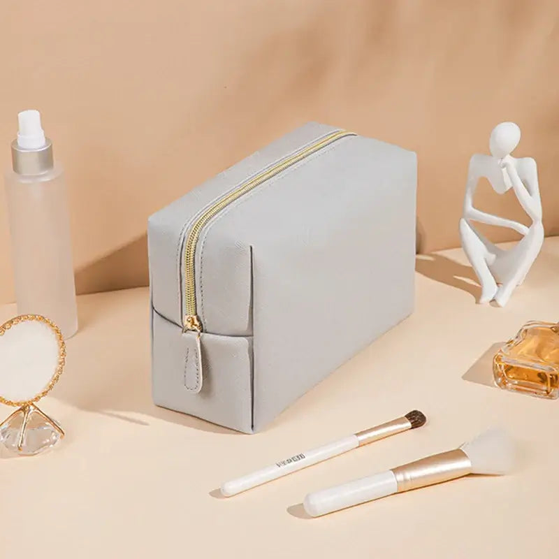 Stay organized in style with Frost Glow’s waterproof PU leather cosmetic bag—perfect for travel, makeup, and toiletry storage. Sleek, durable, and portable.