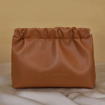 Stylish PU makeup bag with self-closing design. Perfect for travel, cosmetics, and daily essentials. Shop Frost Glow Cosmetics beauty storage today!
