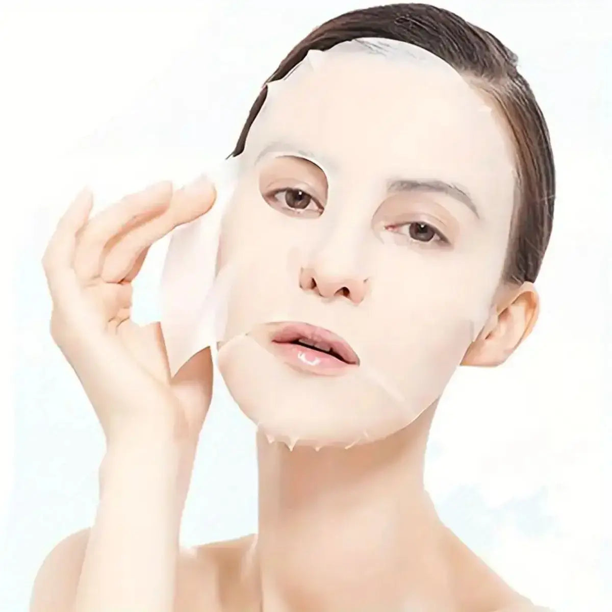 Frost Glow Cosmetics 100pcs facial mask paper sheets are unscented, hydrating & moisture-retentive DIY skincare wraps for soft skin.