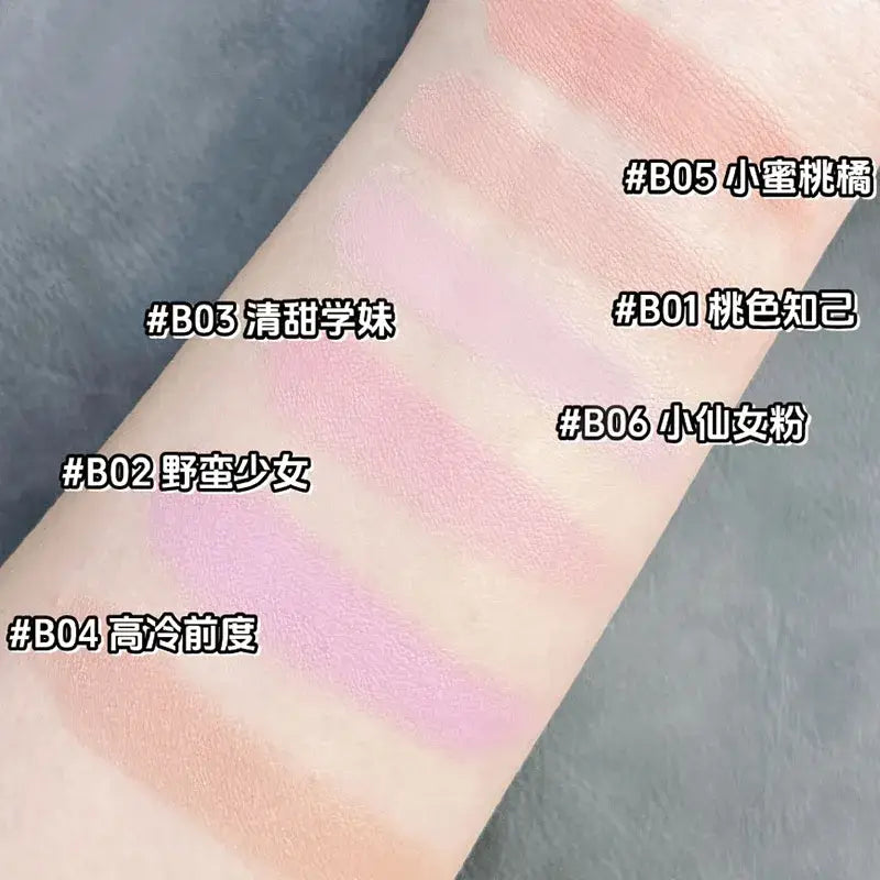 Model showcasing Blooming Blush Powder in B07, featuring soft pink tones and long-lasting cheek tint effect.