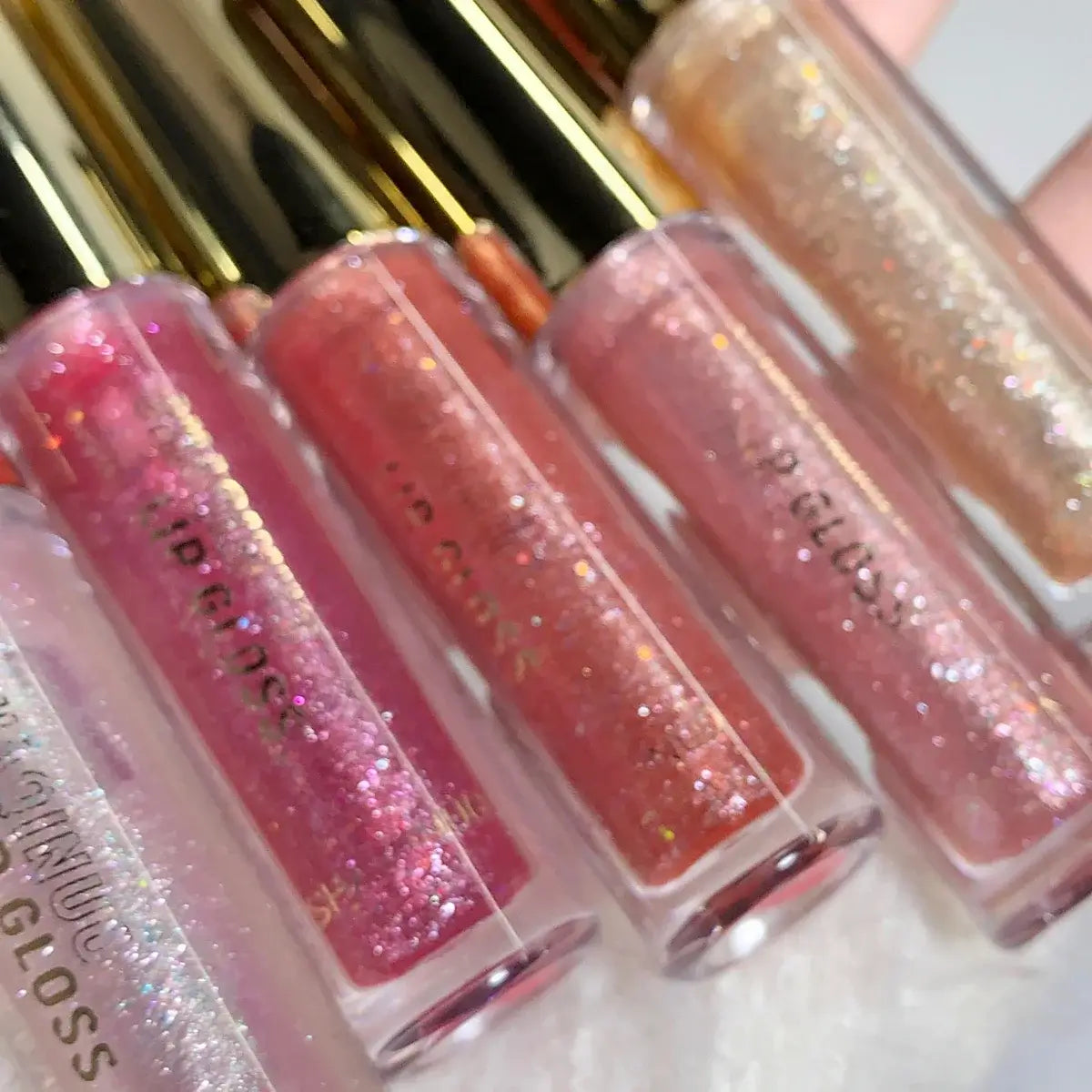 Frost Glow Cosmetics Lip Gloss hydrates, plumps & adds dazzling shine. Moisturizing oil glaze for smooth, pouty, sparkling lips.