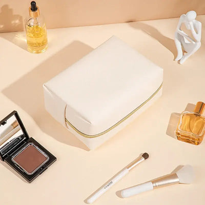 Stay organized in style with Frost Glow’s waterproof PU leather cosmetic bag—perfect for travel, makeup, and toiletry storage. Sleek, durable, and portable.