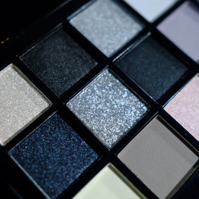 Frost Glow Cosmetics smokey eyeshadow palette. 15 neutral, shimmer & pearly sequin shades for bold punk or soft glam looks.
