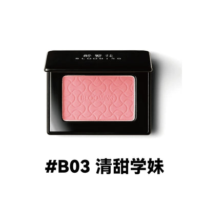 Model showcasing Blooming Blush Powder in B07, featuring soft pink tones and long-lasting cheek tint effect.