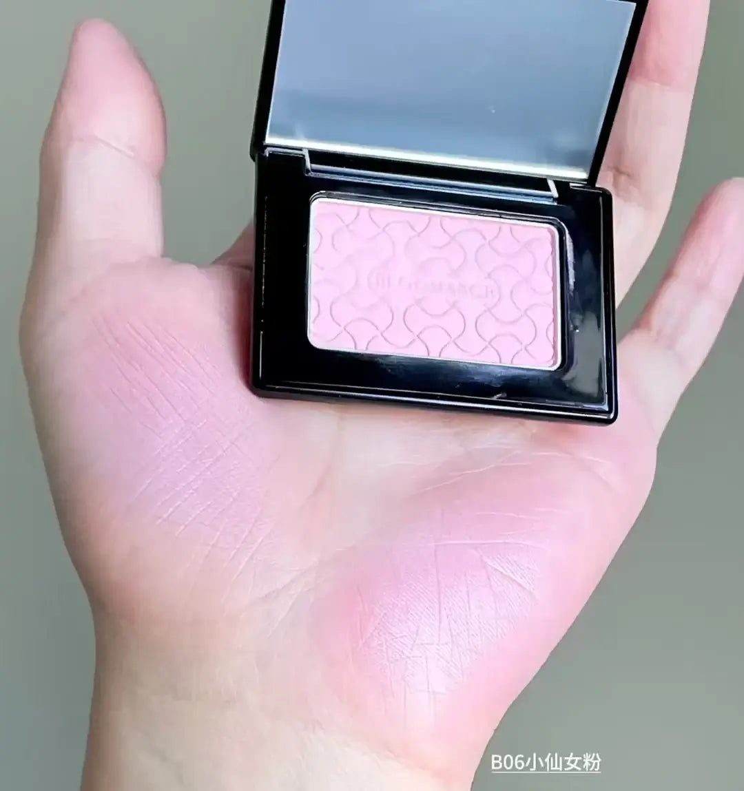 Model showcasing Blooming Blush Powder in B07, featuring soft pink tones and long-lasting cheek tint effect.