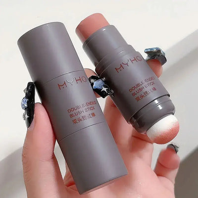 Frost Glow Cosmetics Blush Stick with creamy color swatch on hand and model showcasing a radiant blush application.