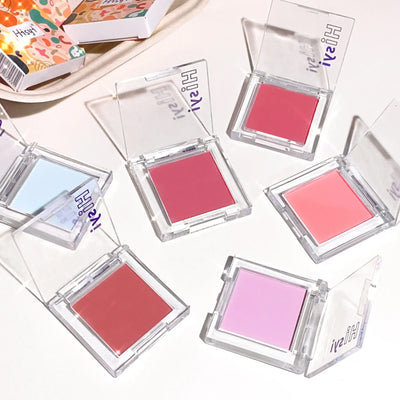 Frost Glow Cosmetics brightening blush in pink tone with applicator and swatch, ideal for a youthful glow.