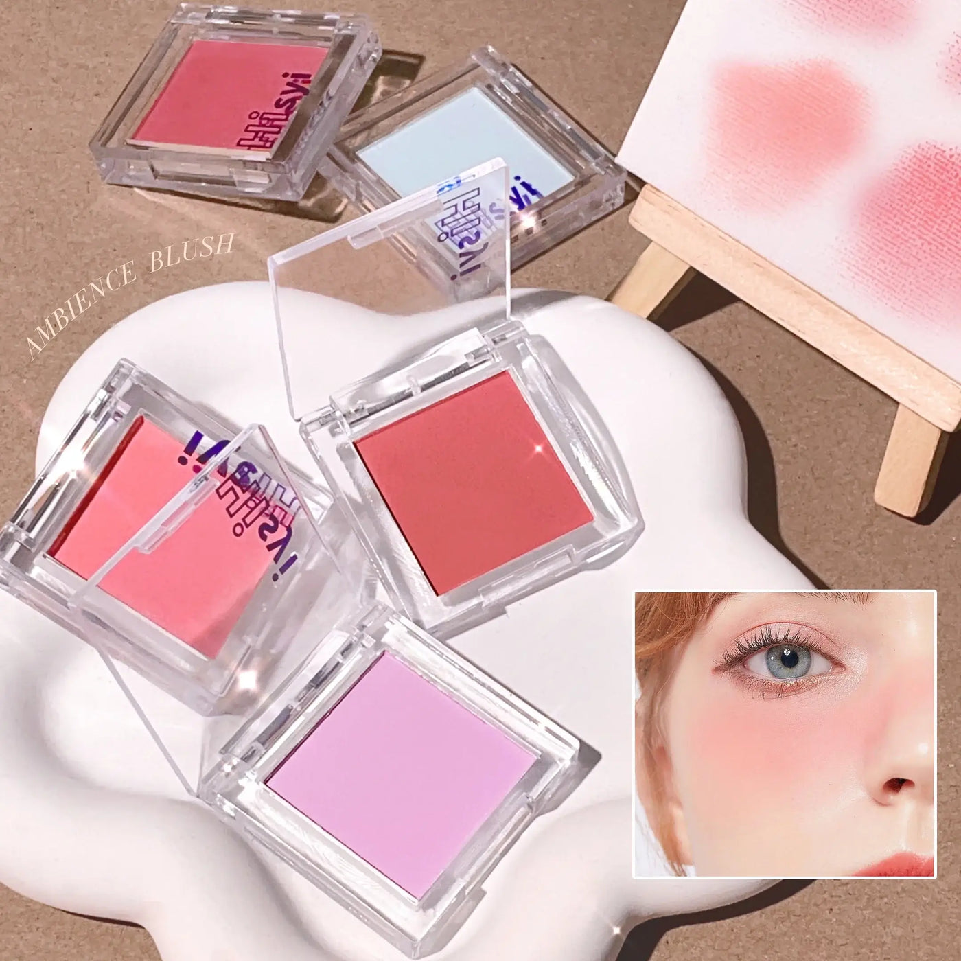 Frost Glow Cosmetics brightening blush in pink tone with applicator and swatch, ideal for a youthful glow.