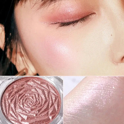 Frost Glow Cosmetics Diamond Glow highlighter showcased on skin and model, featuring shimmering rose-patterned design.