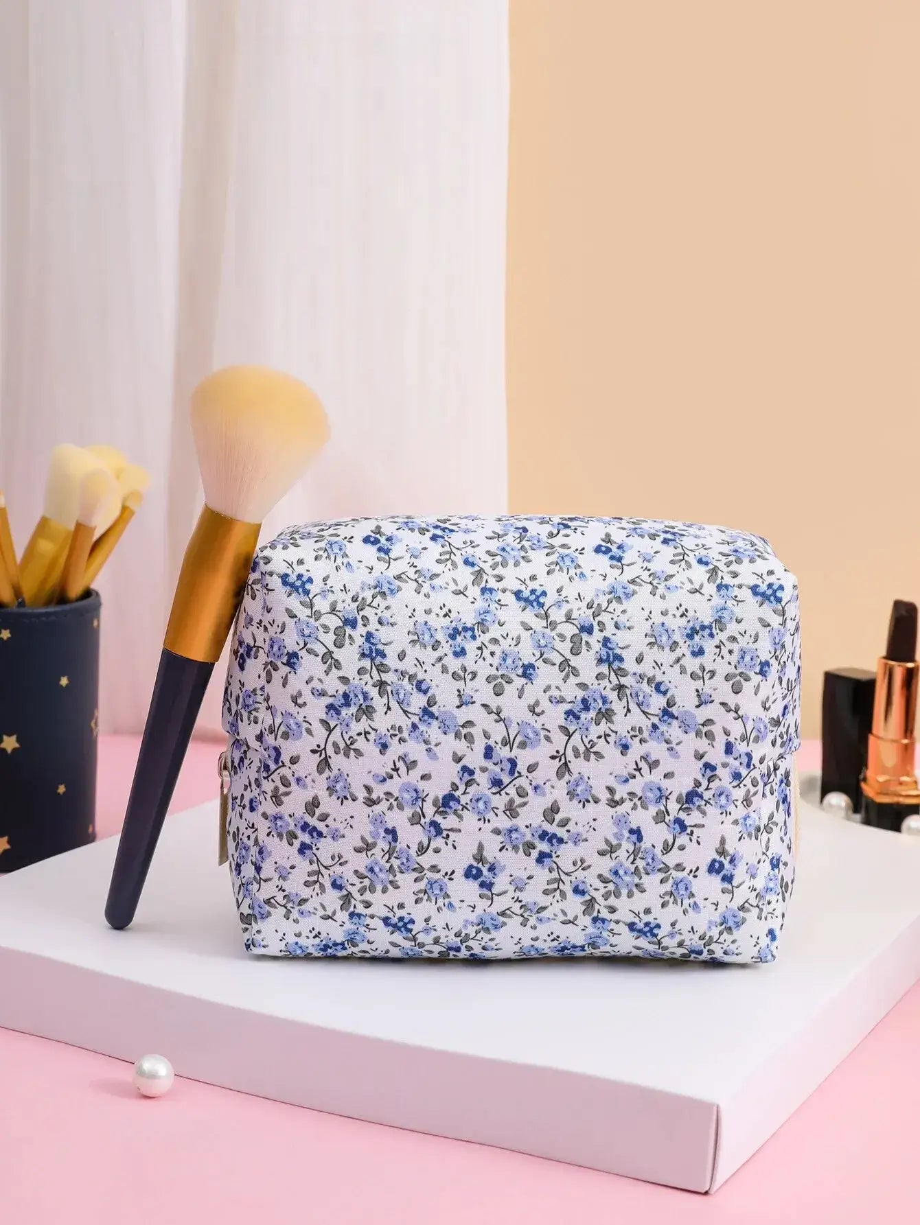Spacious floral quilted makeup bag for travel & daily use. Puffy, stylish & durable design keeps cosmetics organized. Shop Frost Glow Cosmetics today!