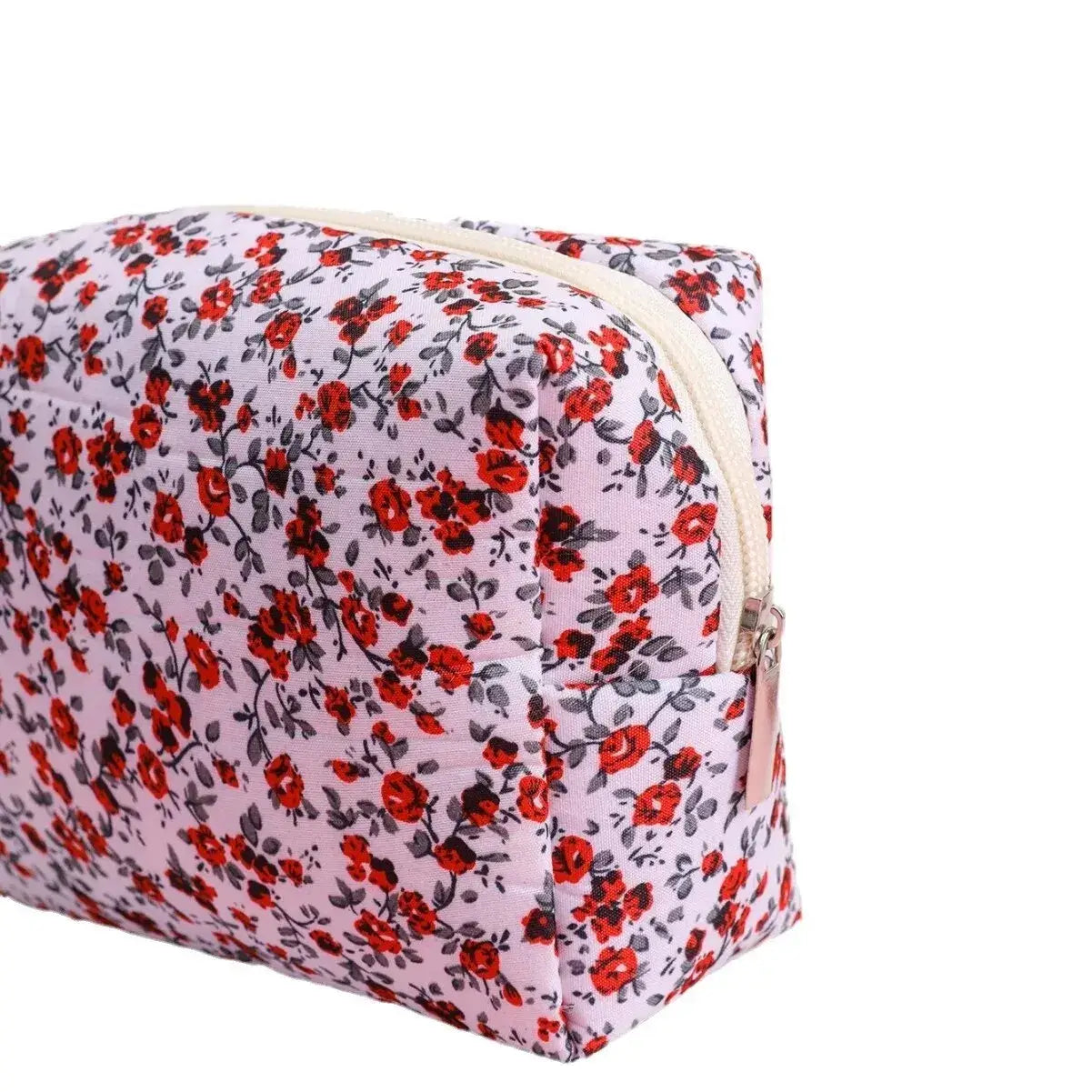 Spacious floral quilted makeup bag for travel & daily use. Puffy, stylish & durable design keeps cosmetics organized. Shop Frost Glow Cosmetics today!