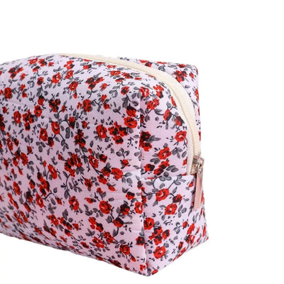 Spacious floral quilted makeup bag for travel & daily use. Puffy, stylish & durable design keeps cosmetics organized. Shop Frost Glow Cosmetics today!