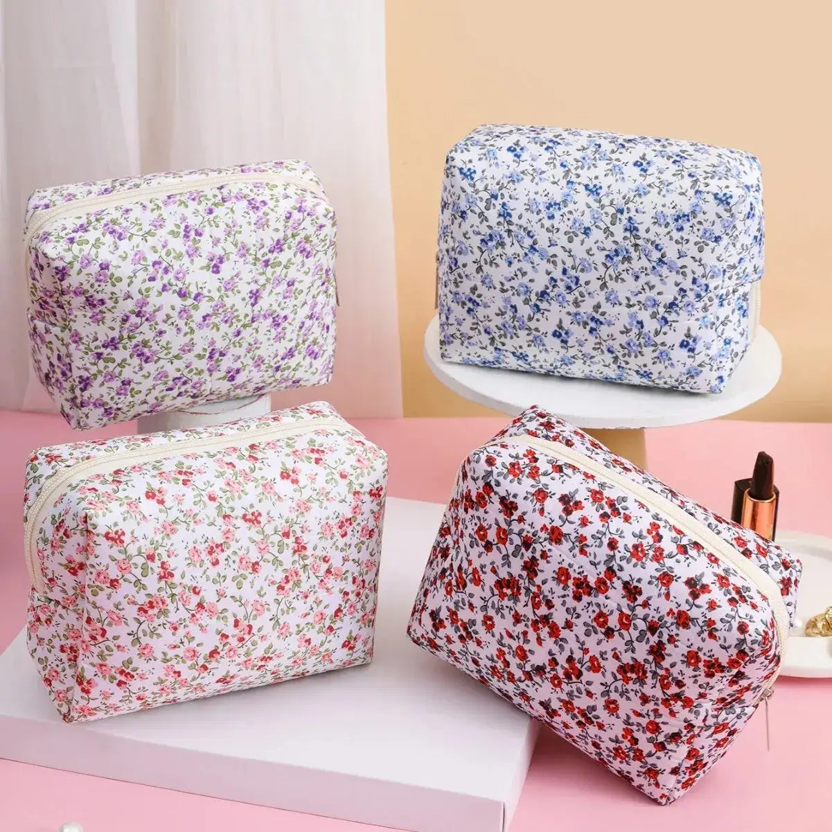 Spacious floral quilted makeup bag for travel & daily use. Puffy, stylish & durable design keeps cosmetics organized. Shop Frost Glow Cosmetics today!