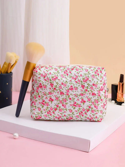 Spacious floral quilted makeup bag for travel & daily use. Puffy, stylish & durable design keeps cosmetics organized. Shop Frost Glow Cosmetics today!