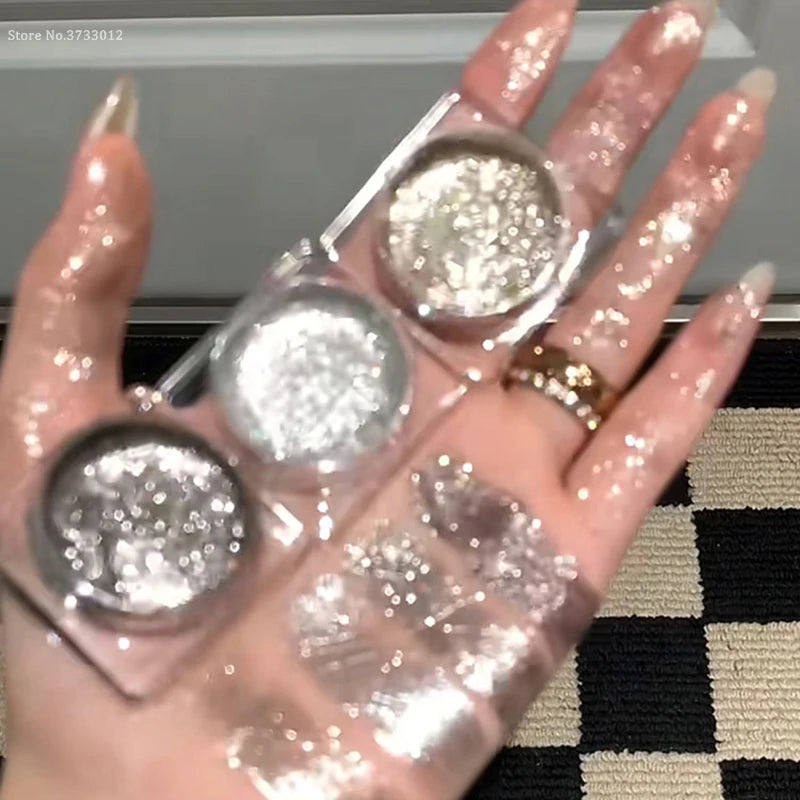 Close-up of shimmery gel eyeshadow in silver shades, with a model featuring sparkling eye makeup.