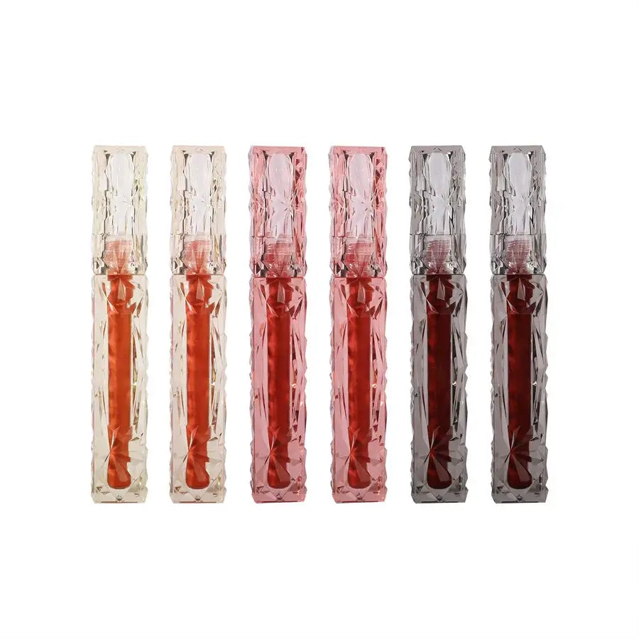 Frost Glow Cosmetics Transparent Lip Gloss delivers mirror-like shine, hydration & waterproof wear. Long-lasting, non-sticky glassy lips.