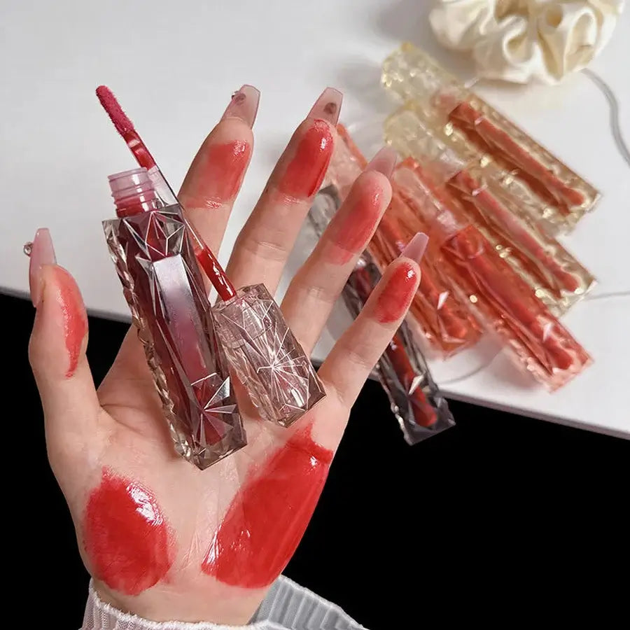 Frost Glow Cosmetics Transparent Lip Gloss delivers mirror-like shine, hydration & waterproof wear. Long-lasting, non-sticky glassy lips.