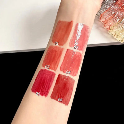 Frost Glow Cosmetics Transparent Lip Gloss delivers mirror-like shine, hydration & waterproof wear. Long-lasting, non-sticky glassy lips.
