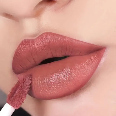 Frost Glow Cosmetics lip liner and matte liquid lipstick on beautifully defined lips, showcasing deep burgundy shades.
