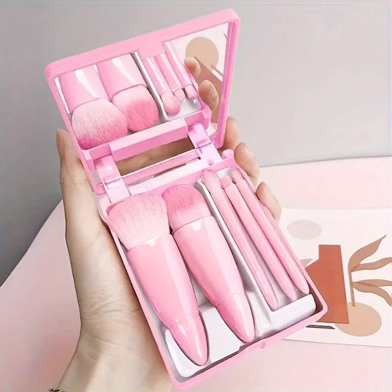 Compact 5pcs portable makeup brush set with foldable mirror. Perfect for travel touch-ups. Shop beauty tools at Frost Glow Cosmetics today!