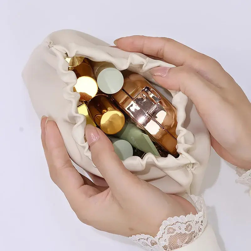 Stylish PU makeup bag with self-closing design. Perfect for travel, cosmetics, and daily essentials. Shop Frost Glow Cosmetics beauty storage today!