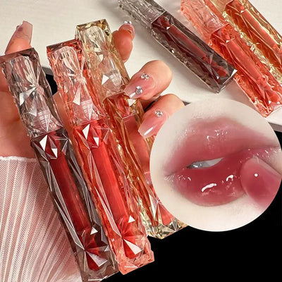 Frost Glow Cosmetics Transparent Lip Gloss delivers mirror-like shine, hydration & waterproof wear. Long-lasting, non-sticky glassy lips.