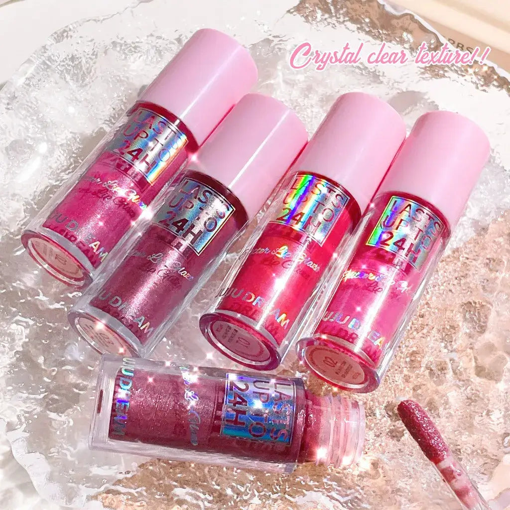 Frost Glow Cosmetics lip gloss with glitter glaze on sparkling pink lips, showcasing long-lasting shimmer in a stylish design.