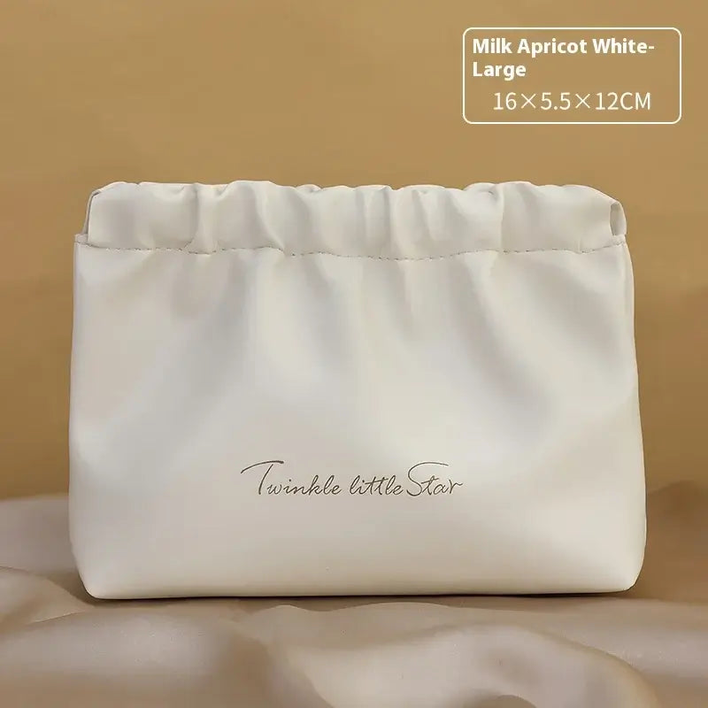 Stylish PU makeup bag with self-closing design. Perfect for travel, cosmetics, and daily essentials. Shop Frost Glow Cosmetics beauty storage today!