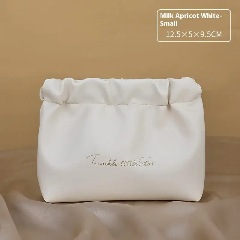 Stylish PU makeup bag with self-closing design. Perfect for travel, cosmetics, and daily essentials. Shop Frost Glow Cosmetics beauty storage today!