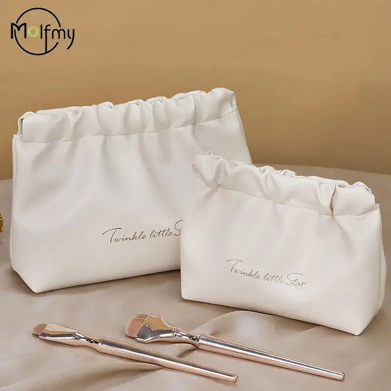 Stylish PU makeup bag with self-closing design. Perfect for travel, cosmetics, and daily essentials. Shop Frost Glow Cosmetics beauty storage today!