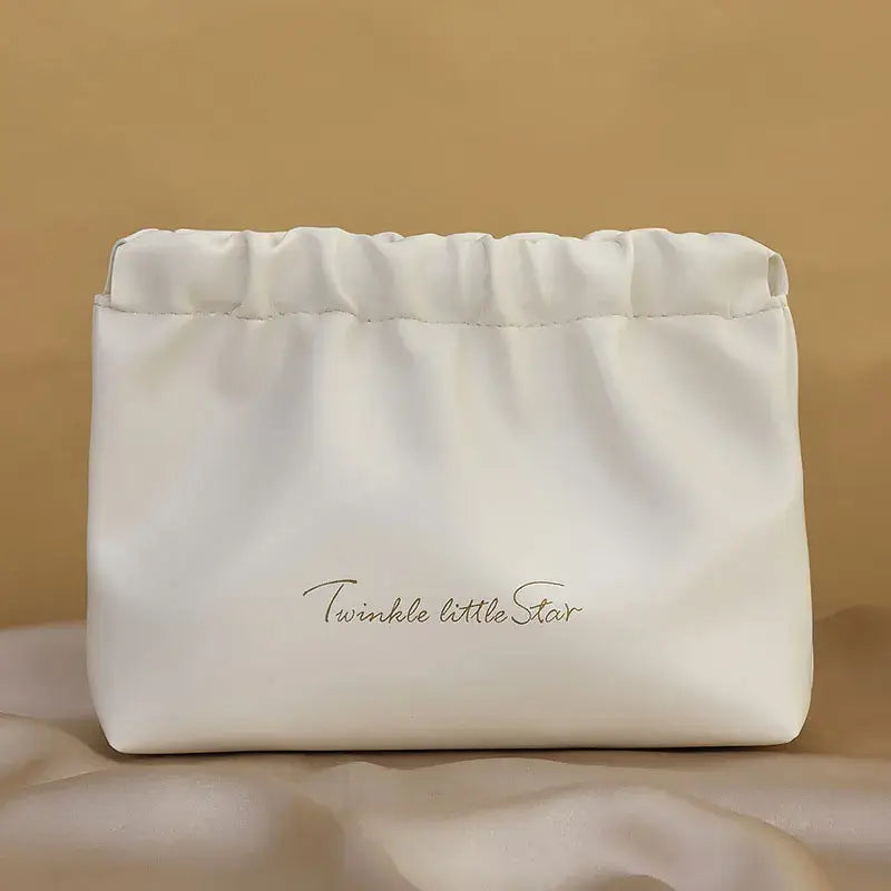 Stylish PU makeup bag with self-closing design. Perfect for travel, cosmetics, and daily essentials. Shop Frost Glow Cosmetics beauty storage today!