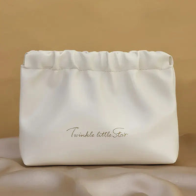 Stylish PU makeup bag with self-closing design. Perfect for travel, cosmetics, and daily essentials. Shop Frost Glow Cosmetics beauty storage today!