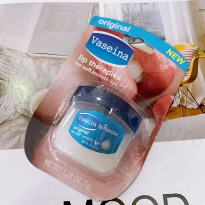 Four Vaseline lip balm jars in packaging, featuring rosy lips, caramel pudding, cocoa butter, and original flavors.