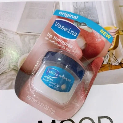Four Vaseline lip balm jars in packaging, featuring rosy lips, caramel pudding, cocoa butter, and original flavors.
