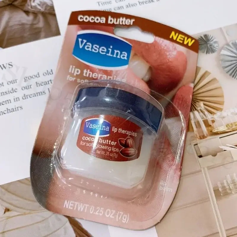 Four Vaseline lip balm jars in packaging, featuring rosy lips, caramel pudding, cocoa butter, and original flavors.